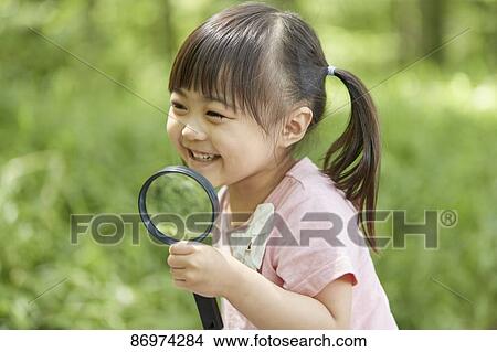 Picture - Japanese kid in a city park. Fotosearch