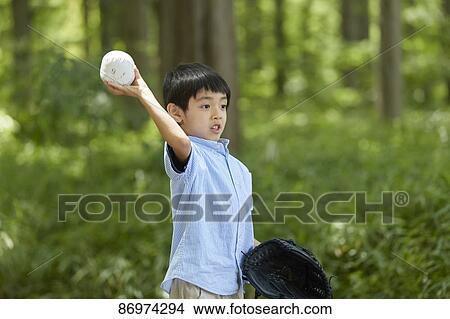Picture - Japanese kid in a city park. Fotosearch