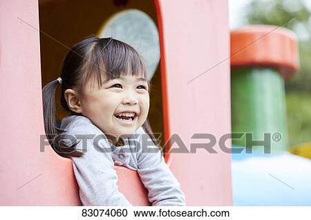 Japanese kid in a city park View Large Photo Image Stock Image - Japanese kid in a city park. Fotosearch