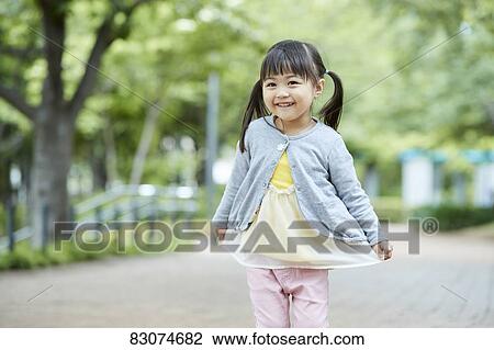 Japanese kid in a city park View Large Photo Image Stock Image - Japanese kid in a city park. Fotosearch