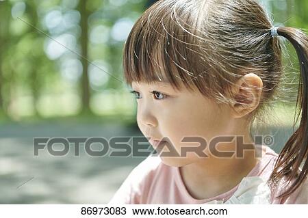 Japanese kid in a city park View Large Photo Image Stock Image - Japanese kid in a city park. Fotosearch