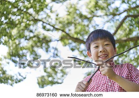 Japanese kid in a city park View Large Photo Image Stock Image - Japanese kid in a city park. Fotosearch