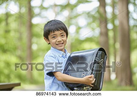 Japanese kid in a city park View Large Photo Image Stock Image - Japanese kid in a city park. Fotosearch