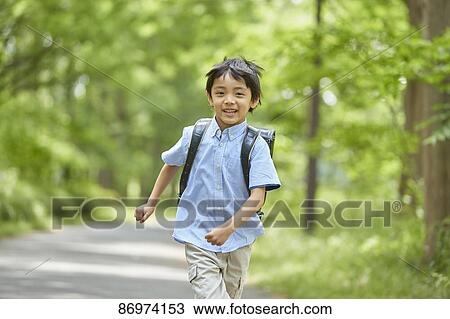Japanese kid in a city park View Large Photo Image Stock Image - Japanese kid in a city park. Fotosearch