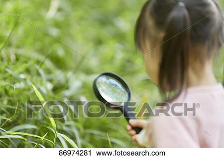 Stock Image - Japanese kid in a city park. Fotosearch
