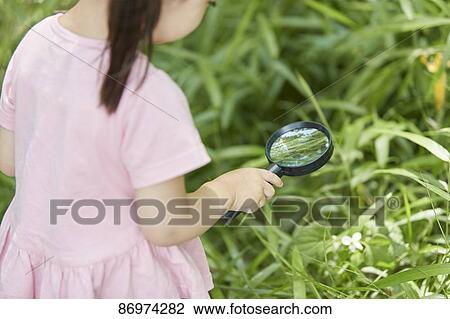 Stock Image - Japanese kid in a city park. Fotosearch
