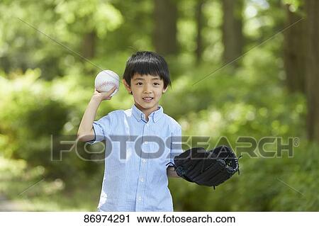 Stock Image - Japanese kid in a city park. Fotosearch