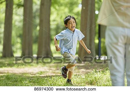 Japanese kid in a city park View Large Photo Image Stock Image - Japanese kid in a city park. Fotosearch