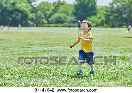 Japanese kid in a city park View Large Photo Image Stock Image - Japanese kid in a city park. Fotosearch