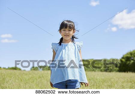 Japanese kid in a city park View Large Photo Image Stock Image - Japanese kid in a city park. Fotosearch