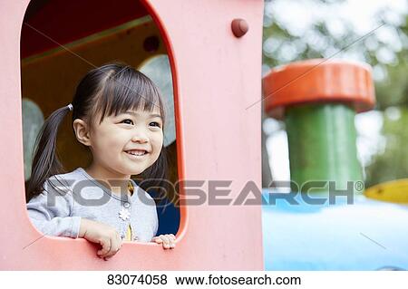 Stock Photo - Japanese kid in a city park. Fotosearch