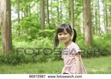 Japanese kid in a city park View Large Photo Image Stock Photo - Japanese kid in a city park. Fotosearch