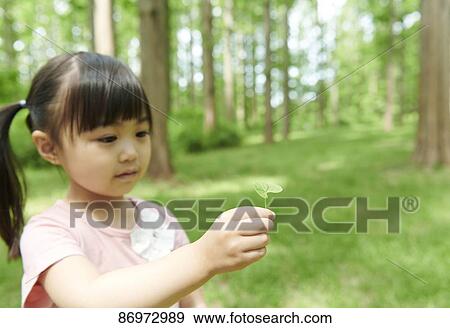 Japanese kid in a city park View Large Photo Image Stock Photo - Japanese kid in a city park. Fotosearch