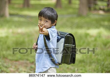 Stock Photo - Japanese kid in a city park. Fotosearch