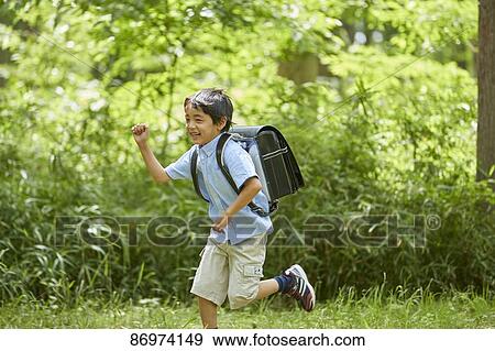 Japanese kid in a city park View Large Photo Image Stock Photo - Japanese kid in a city park. Fotosearch