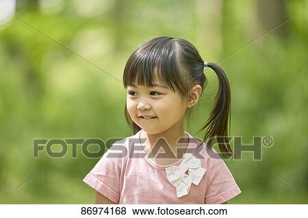 Japanese kid in a city park View Large Photo Image Stock Photo - Japanese kid in a city park. Fotosearch