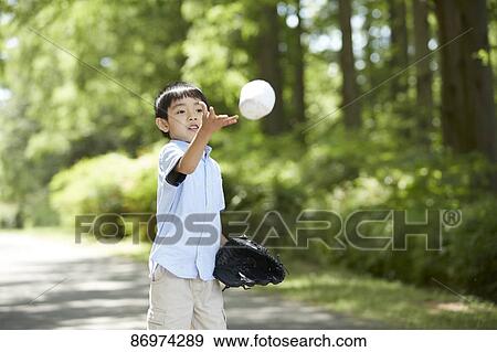 Stock Photo - Japanese kid in a city park. Fotosearch