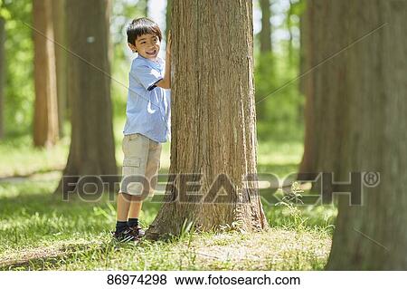 Japanese kid in a city park View Large Photo Image Stock Photo - Japanese kid in a city park. Fotosearch