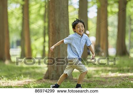 Japanese kid in a city park View Large Photo Image Stock Photo - Japanese kid in a city park. Fotosearch