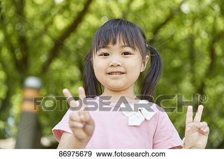 Japanese kid in a city park View Large Photo Image Stock Photo - Japanese kid in a city park. Fotosearch
