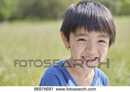 Stock Photo - Japanese kid in a city park. Fotosearch