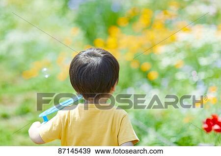 Japanese kid in a city park View Large Photo Image Stock Photo - Japanese kid in a city park. Fotosearch
