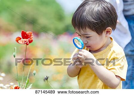 Stock Photo - Japanese kid in a city park. Fotosearch