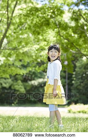 Japanese kid in a city park View Large Photo Image Stock Photo - Japanese kid in a city park. Fotosearch