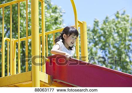 Stock Photo - Japanese kid in a city park. Fotosearch