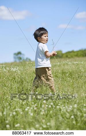 Japanese kid in a city park View Large Photo Image Stock Photo - Japanese kid in a city park. Fotosearch