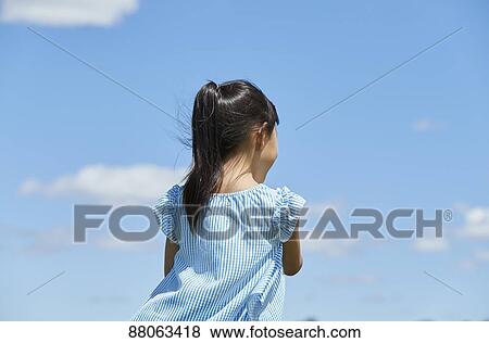 Japanese kid in a city park View Large Photo Image Stock Photo - Japanese kid in a city park. Fotosearch