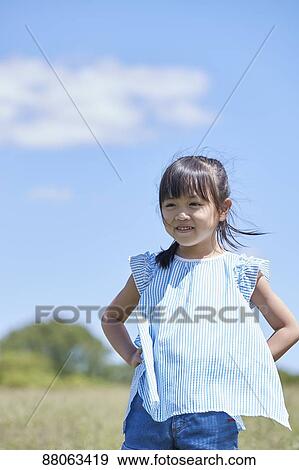 Japanese kid in a city park View Large Photo Image Stock Photo - Japanese kid in a city park. Fotosearch