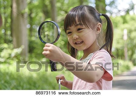 Japanese kid in a city park View Large Photo Image Stock Photograph - Japanese kid in a city park. Fotosearch