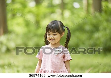 Japanese kid in a city park View Large Photo Image Stock Photograph - Japanese kid in a city park. Fotosearch