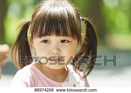 Japanese kid in a city park View Large Photo Image Stock Photograph - Japanese kid in a city park. Fotosearch