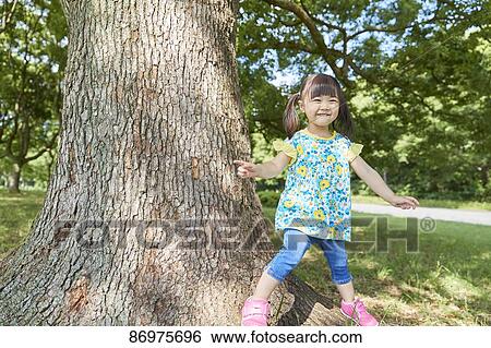 Japanese kid in a city park View Large Photo Image Stock Photograph - Japanese kid in a city park. Fotosearch