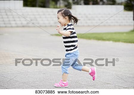Japanese kid in a city park View Large Photo Image Stock Photography - Japanese kid in a city park. Fotosearch