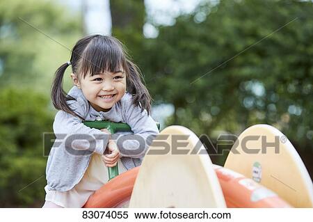 Japanese kid in a city park View Large Photo Image Stock Photography - Japanese kid in a city park. Fotosearch