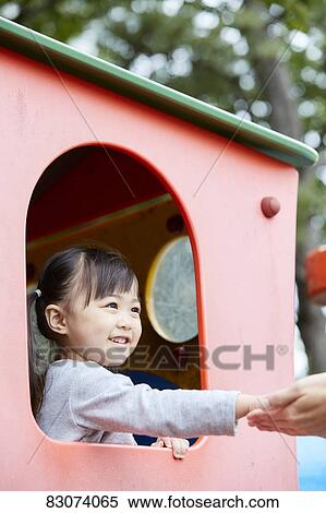 Stock Photography - Japanese kid in a city park. Fotosearch