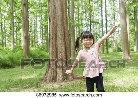 Stock Photography - Japanese kid in a city park. Fotosearch