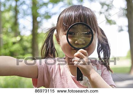 Stock Photography - Japanese kid in a city park. Fotosearch