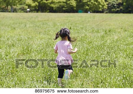 Japanese kid in a city park View Large Photo Image Stock Photography - Japanese kid in a city park. Fotosearch