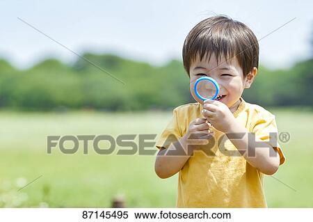 Stock Photography - Japanese kid in a city park. Fotosearch