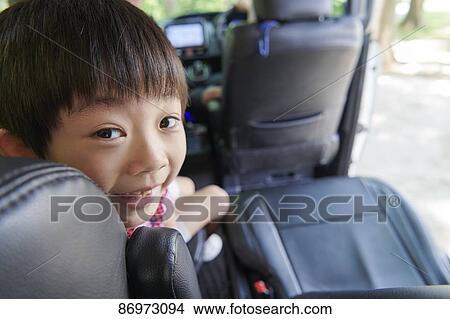Japanese kid in the car View Large Photo Image Picture - Japanese kid in the car. Fotosearch