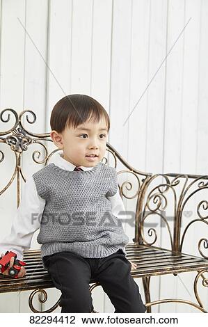 Stock Image - Japanese kid studio photo shoot. Fotosearch