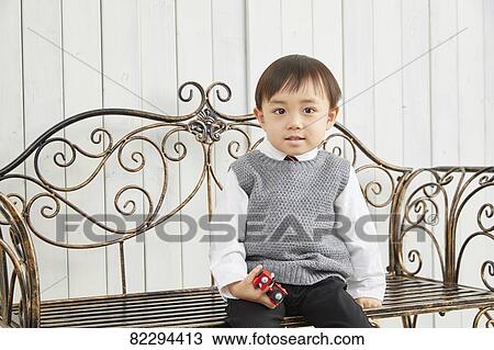 Stock Image - Japanese kid studio photo shoot. Fotosearch