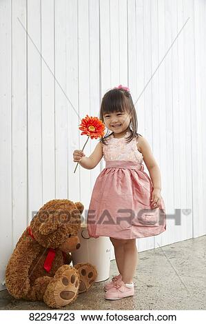 Stock Image - Japanese kid studio photo shoot. Fotosearch