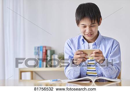 Japanese kid studying at home View Large Photo Image Stock Image - Japanese kid studying at home. Fotosearch