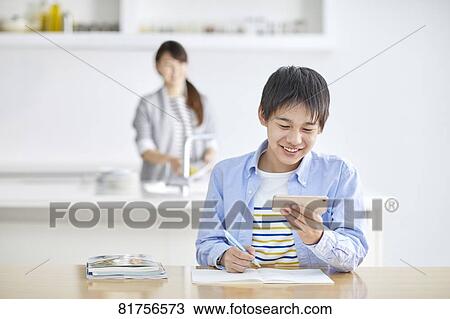 Japanese kid studying at home View Large Photo Image Stock Image - Japanese kid studying at home. Fotosearch