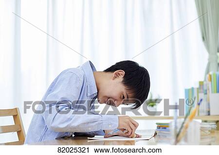 Japanese kid studying at home View Large Photo Image Stock Image - Japanese kid studying at home. Fotosearch